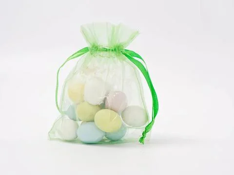 Colorful easter eggs in a green decorative bag Stock Photos
