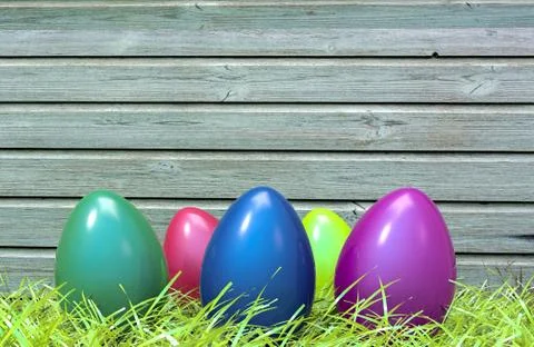 Colorful Easter eggs in green grass and wooden plank in background. 3D 스톡 일러스트