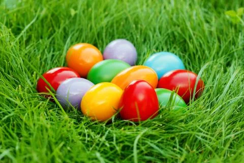 Colorful easter eggs on the green grass Stock Photos