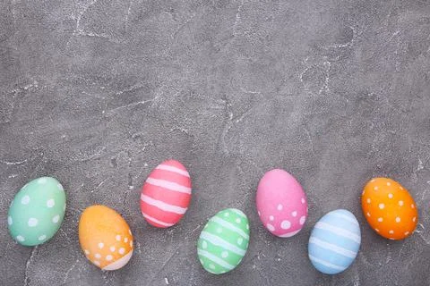 Colorful easter eggs on grey cement background Stock Photos