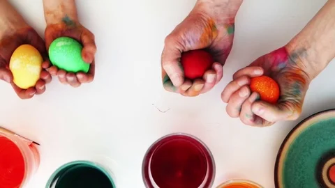 Colorful easter eggs in hands. Top view Stock Footage 72152217