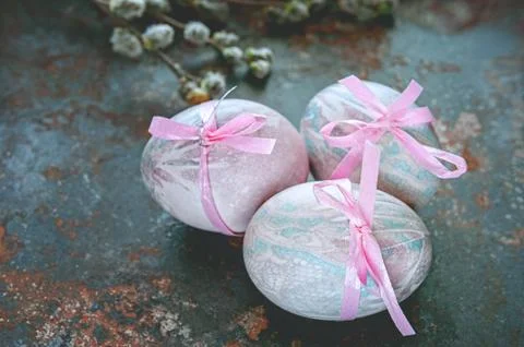 Colorful Easter eggs lying on a beautiful vintage background with bouquet mad Stock Photos