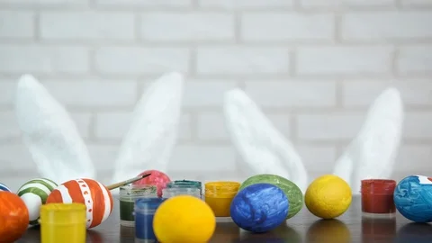 Colorful Easter eggs lying on table. 動画素材 104394586