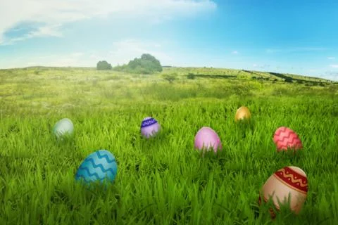 Colorful easter eggs in the meadow Stock Photos