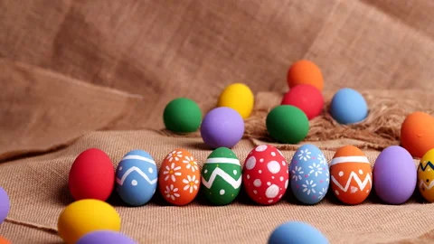 Colorful easter eggs on natural burlap, Dolly shot. Happy Easter Day. Stock Footage 149050374