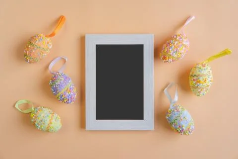 Colorful easter eggs on orange background with copy space, Top view Fotos Stock