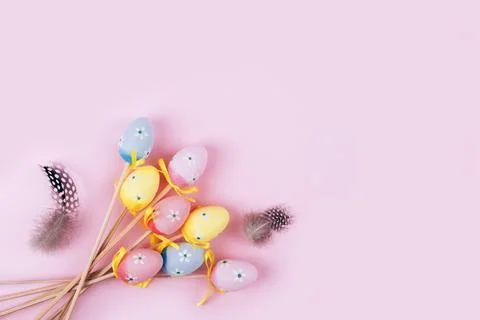 Colorful Easter eggs over pink background. Stock Photos