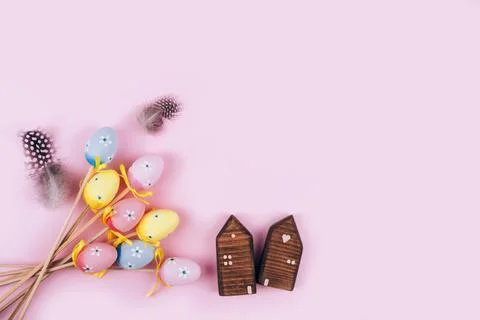 Colorful Easter eggs over pink background. Stock Photos