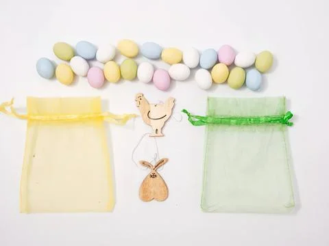 Colorful easter eggs with paper bunny and gift bags Stock Photos