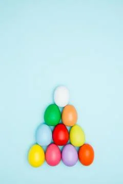 Colorful easter eggs on pastel background, Triangle Shape 스톡 사진