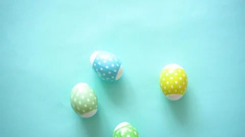 Colorful Easter eggs pastel tone with print of peas chaotically spinning like Stock Footage 112394118