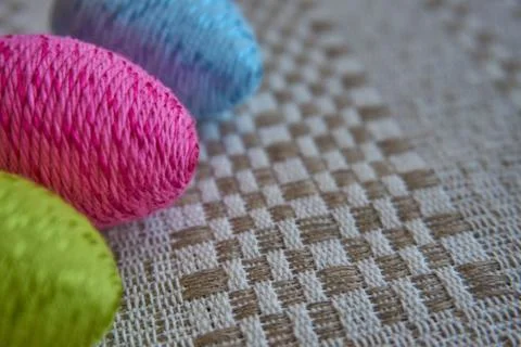 Colorful easter eggs on a patterned linen tablecloth Foto stock