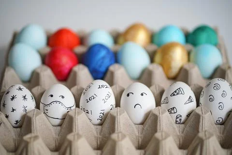 Colorful Easter eggs with patterns in cardboard stand Stock Photos