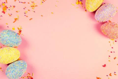 Colorful easter eggs on pink background. Stock Photos
