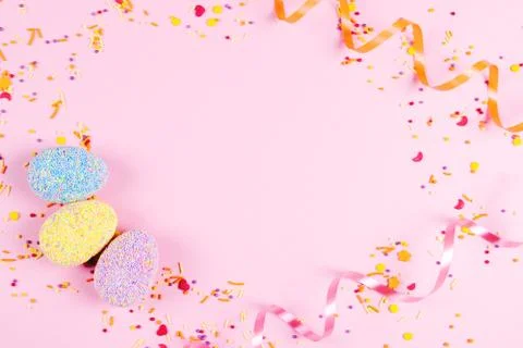 Colorful easter eggs on pink background. Stock Photos