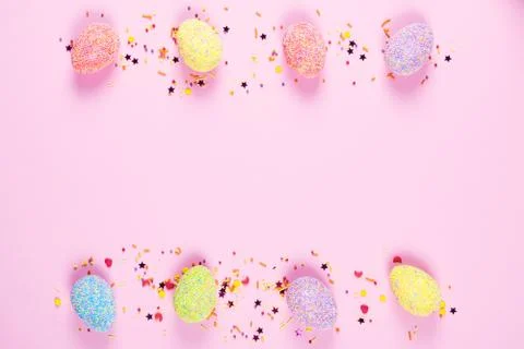 Colorful easter eggs on pink background. Stock Photos