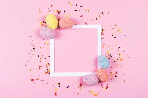 Colorful easter eggs on pink background. Stock Photos