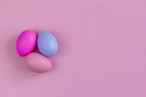 Colorful Easter eggs on a pink background, top view., Stock Photos
