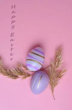 Colorful Easter eggs on a pink background. Stock Photos