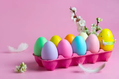 Colorful Easter Eggs in Pink Egg Tray. Stock Photos