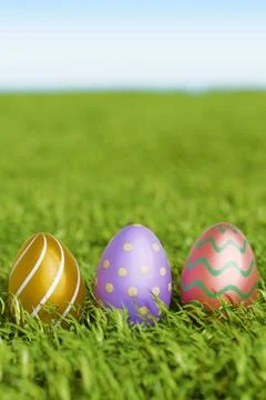 Colorful easter eggs resting on green grass. Stock Illustration