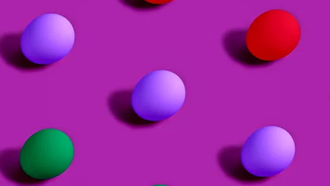 Colorful Easter Eggs rotating in rows in seamless loop on violet background. Stock Footage 150046105
