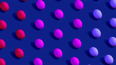 Colorful Easter Eggs rotating in rows in seamless loop on dark violet background Stock Footage 150046187