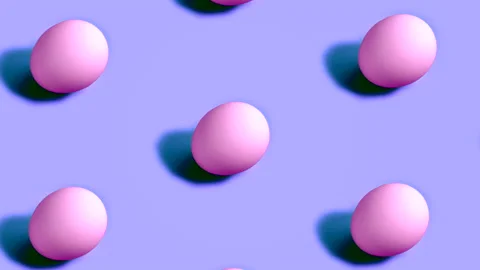 Colorful Easter Eggs rotating in rows in seamless loop on violet background. Stock Footage 150046428