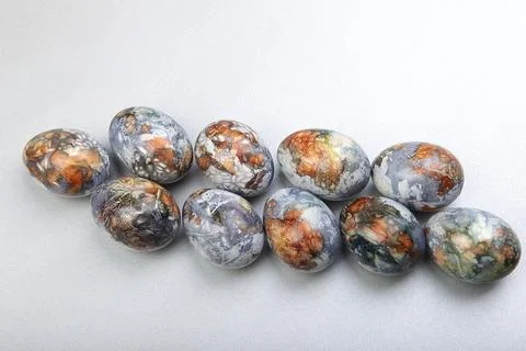 Colorful easter eggs row painted in natural products blueberries and onion pe Stock Photos