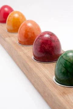 Colorful easter eggs in a row on white background Stock Photos