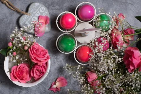 Colorful easter eggs scattered on gray concrete background, top view Stock Photos
