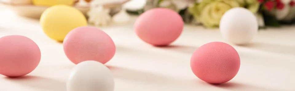 Colorful easter eggs scattered table Stock Photos