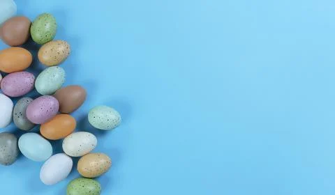 Colorful Easter eggs on sky blue background Stock Photos