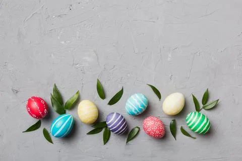 Colorful Easter eggs with spring flower leaf isolated over white background.  库存照片