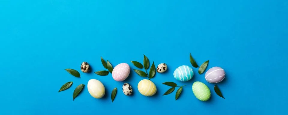 Colorful Easter eggs with spring flower leaf isolated over white background.. Stock Photos