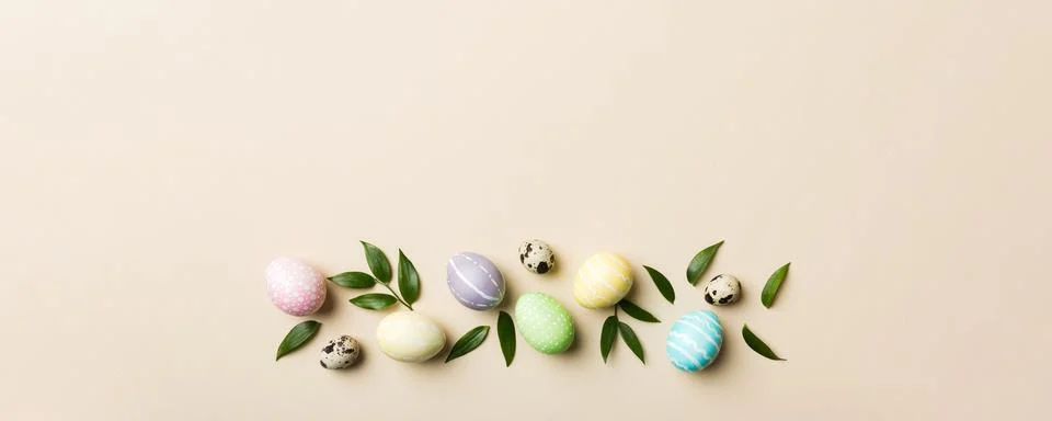 Colorful Easter eggs with spring flower leaf isolated over white background.. Stock Photos