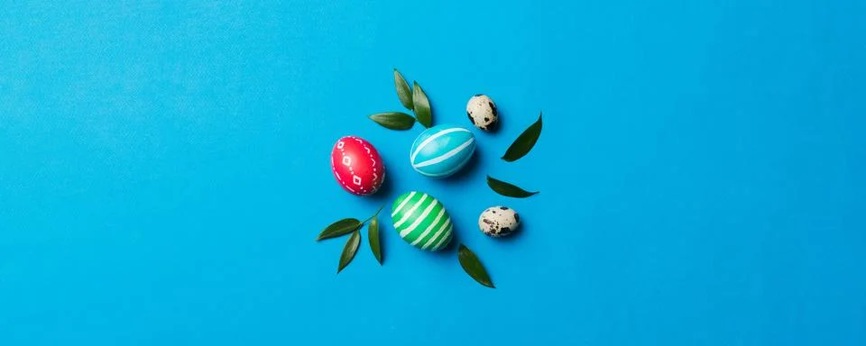 Colorful Easter eggs with spring flower leaf isolated over white background.. Stock Photos