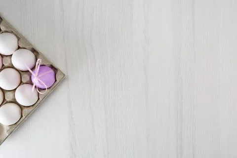 Colorful easter eggs on a stand on a gray table with place for text, top view Stock Photos