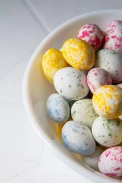Colorful Easter eggs. sweets in the form of quail eggs. Vertical photo Stock Photos