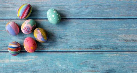 Colorful Easter eggs on table. Easter festive holidays concept. Stock Photos