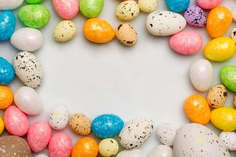 Colorful easter eggs top view on white background Stock Photos