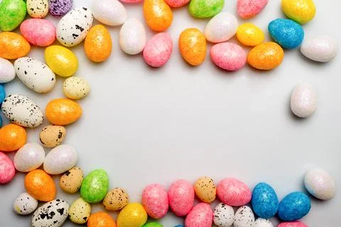 Colorful easter eggs top view on white background Stock Photos