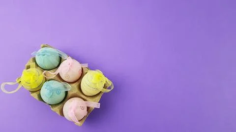 Colorful Easter eggs on a very peri background. Stock Photos