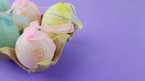 Colorful Easter eggs on a very peri background. Stock Photos