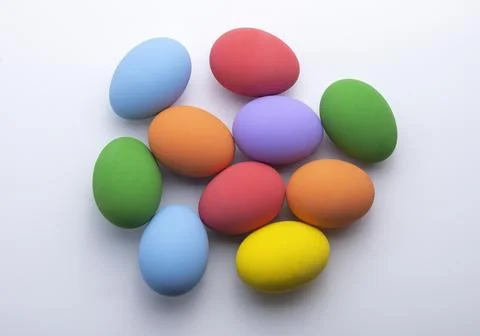 Colorful easter eggs on white background. Colorful eggs. Top view. Stock Photos
