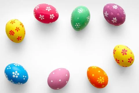 Colorful Easter eggs on white with copy space. Top view. Flat lay. Foto stock