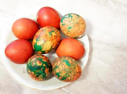 Colorful Easter Eggs On White Plate Placed By Heap Stock Photos