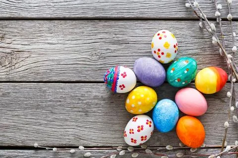 Colorful easter eggs on wooden surface for spring holiday Stock Photos