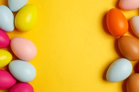 Colorful Easter eggs on a yellow background Stock Photos