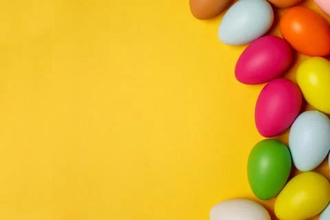 Colorful Easter eggs on a yellow background Stock Photos